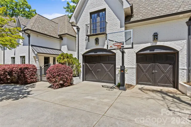 a large kitchen with stainless steel appliances a large counter top