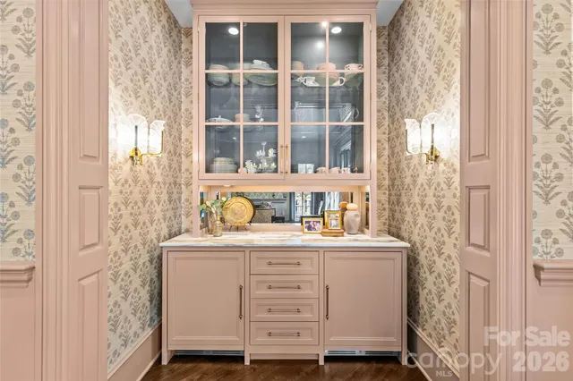 a room with cabinets and a wooden door