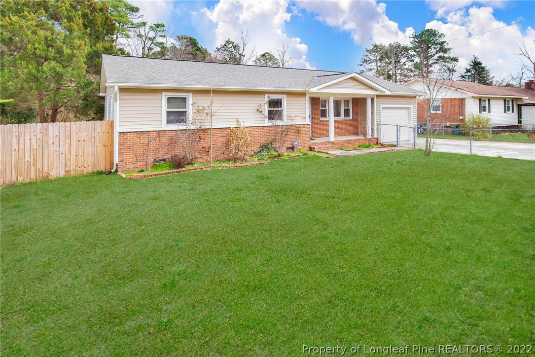 1813 Ashton Road Fayetteville, NC 28304 - Photo 24 of 25 a front view of house with yard and green space