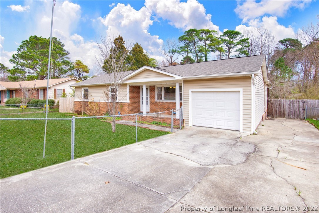 1813 Ashton Road Fayetteville, NC 28304 - Photo 25 of 25 a front view of a house with a garden and yard