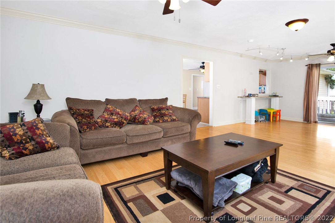 1813 Ashton Road Fayetteville, NC 28304 - Photo 5 of 25 a living room with furniture and wooden floor