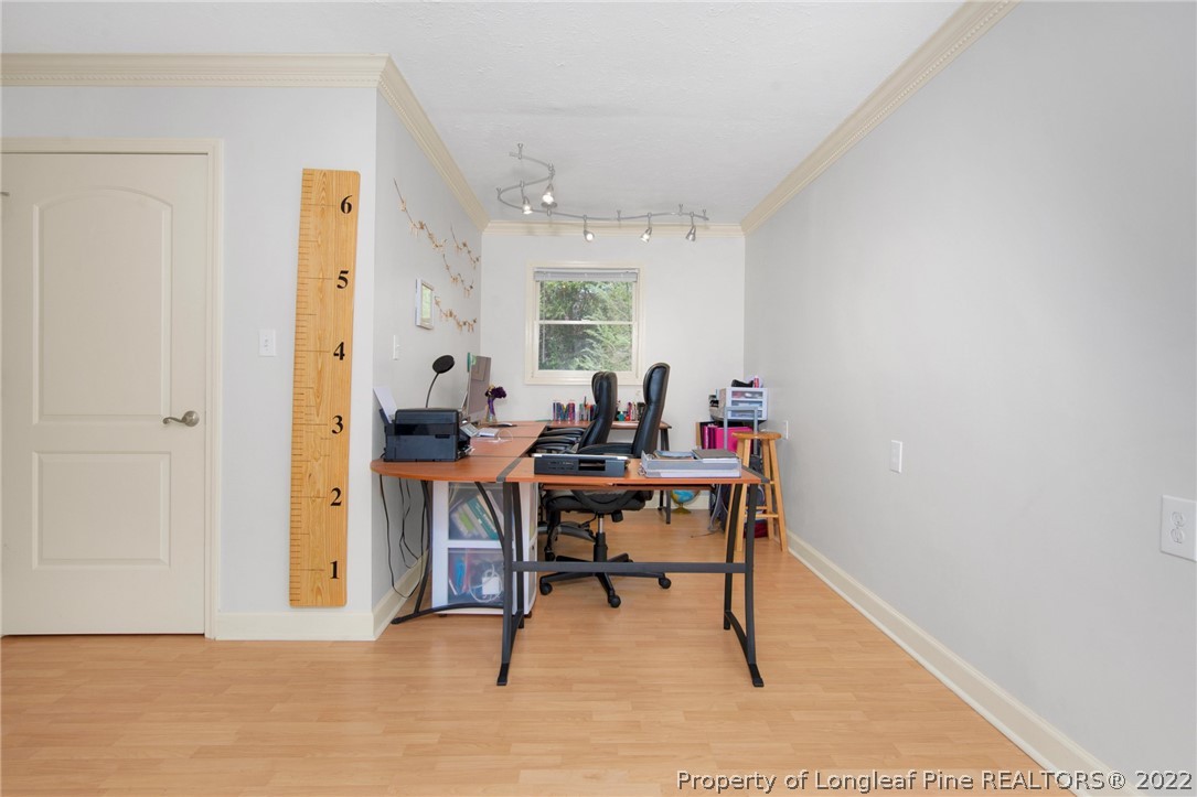 1813 Ashton Road Fayetteville, NC 28304 - Photo 10 of 25 a view of a workspace with furniture and a window