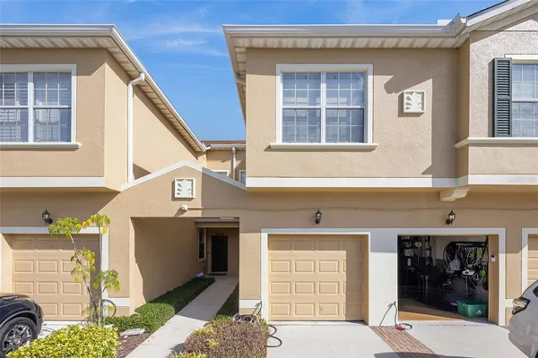 a front view of a house with a garage