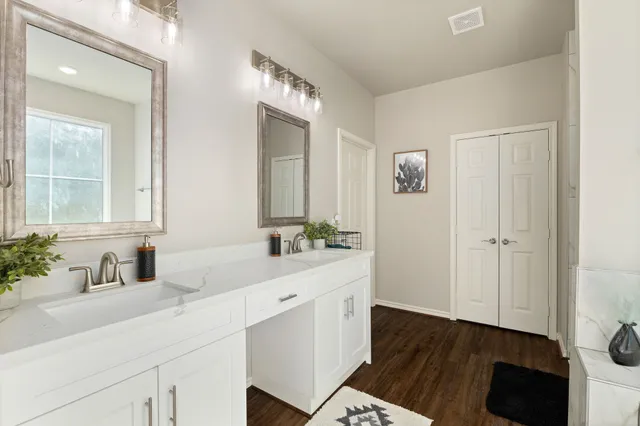 a bathroom with a sink and a mirror