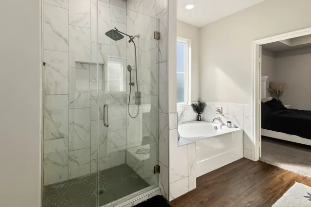 a bathroom with a shower a sink and a mirror