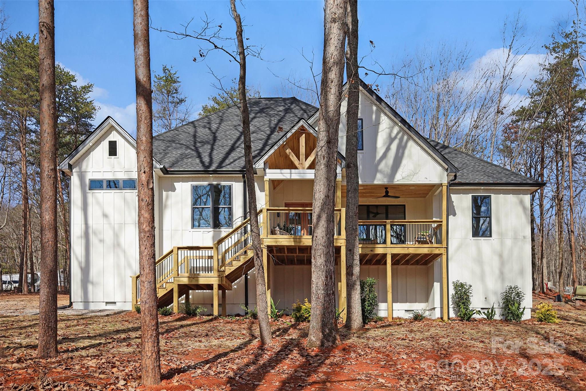 5304 West Liberty Hill Road York, SC 29745 - Photo 1 of 41 a view of a house with large windows and wooden fence