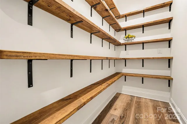 a bedroom with a bed window and a couch