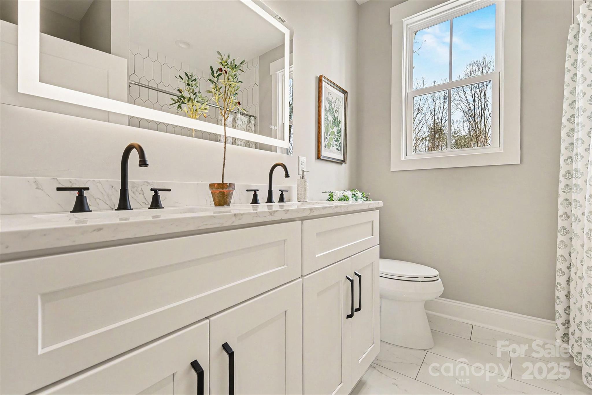 5304 West Liberty Hill Road York, SC 29745 - Photo 25 of 41 a bathroom with a toilet sink and mirror