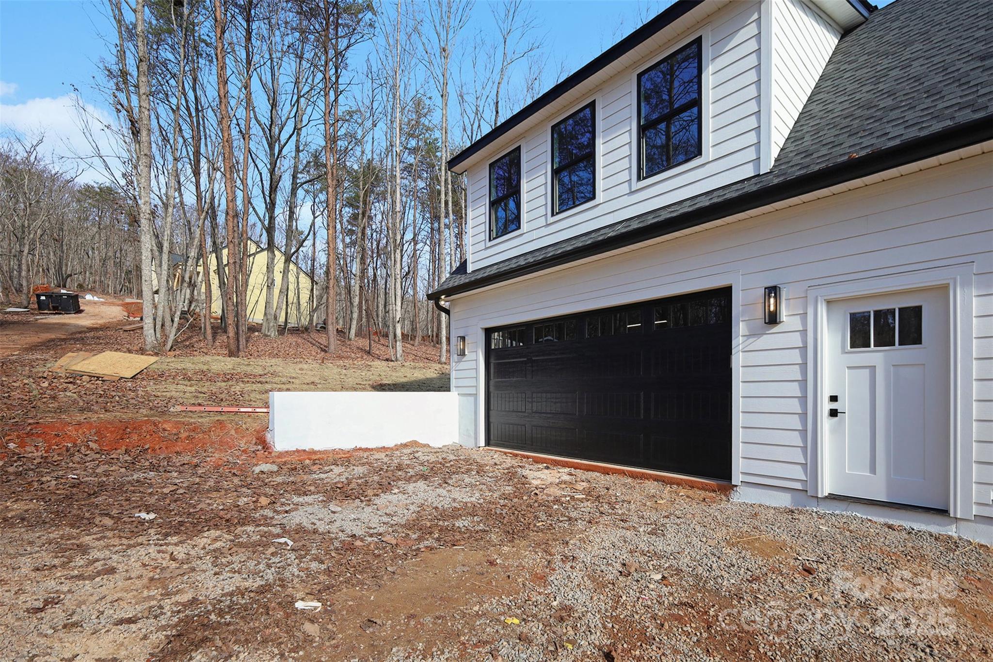 5304 West Liberty Hill Road York, SC 29745 - Photo 36 of 41 a front view of a house with a yard and garage