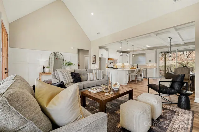 a living room with lots of furniture and a table