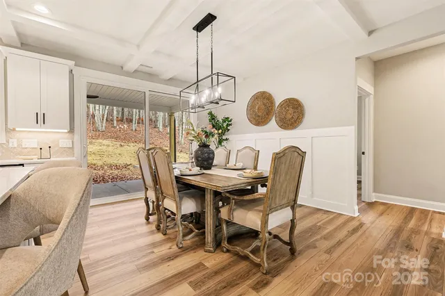 a large kitchen with a table and chairs