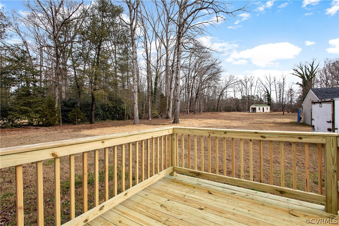 13007 Lewis Road Chester, VA 23831 - Photo 32 of 37 10X8 Deck with view of back yard, 20X10 shed and o