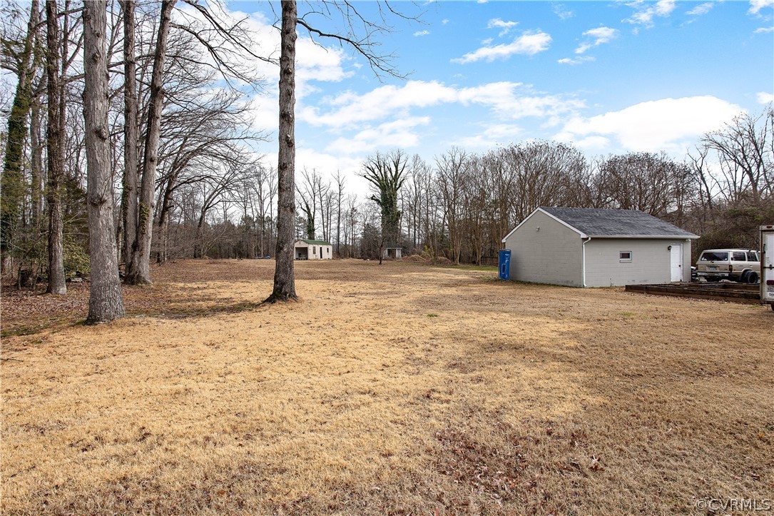 13007 Lewis Road Chester, VA 23831 - Photo 33 of 37 Back Yard with view of 20X10 Shed and one car gara