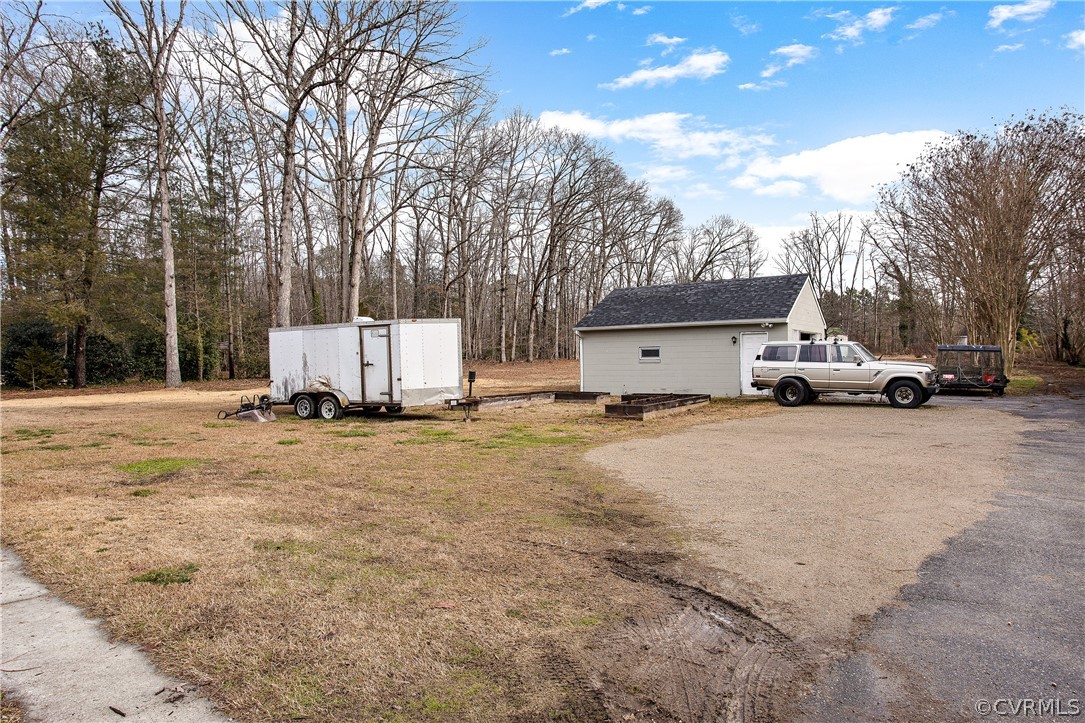 13007 Lewis Road Chester, VA 23831 - Photo 34 of 37 Back yard with view of one car garage