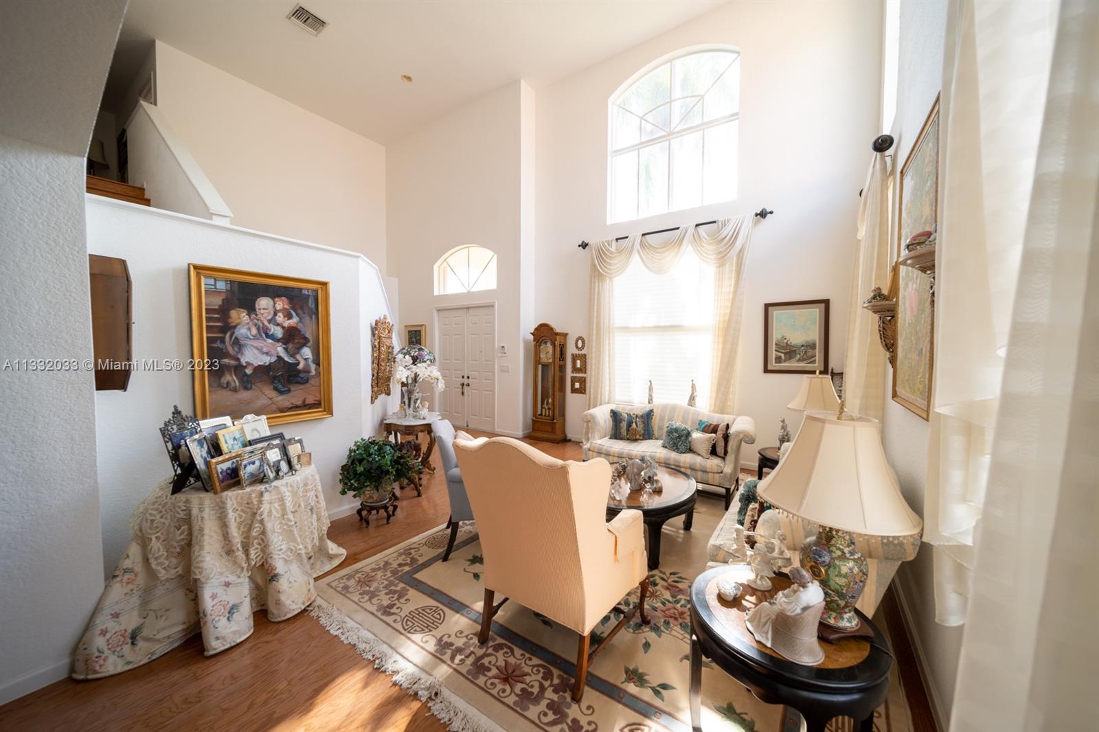 3961 Nighthawk Drive Weston, FL 33331 - Photo 13 of 35 a view of a dining room with furniture window and wooden floor