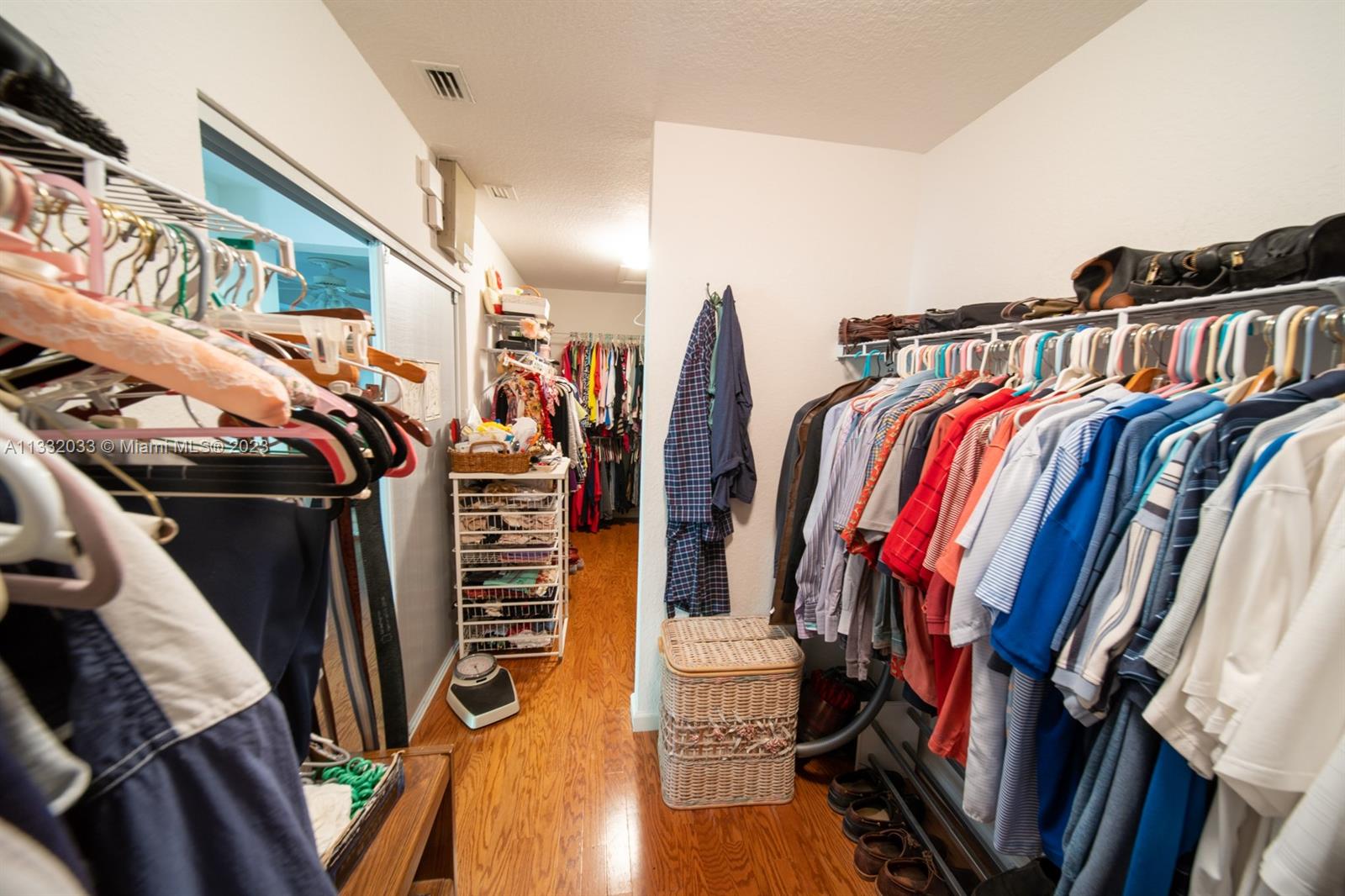 3961 Nighthawk Drive Weston, FL 33331 - Photo 25 of 35 a view of walk in closet with clothes and shoes
