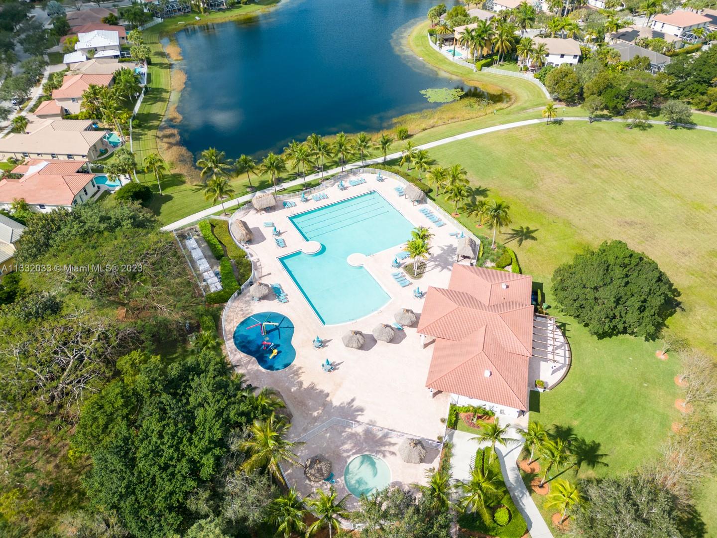 3961 Nighthawk Drive Weston, FL 33331 - Photo 33 of 35 an aerial view of a house with a yard and lake view