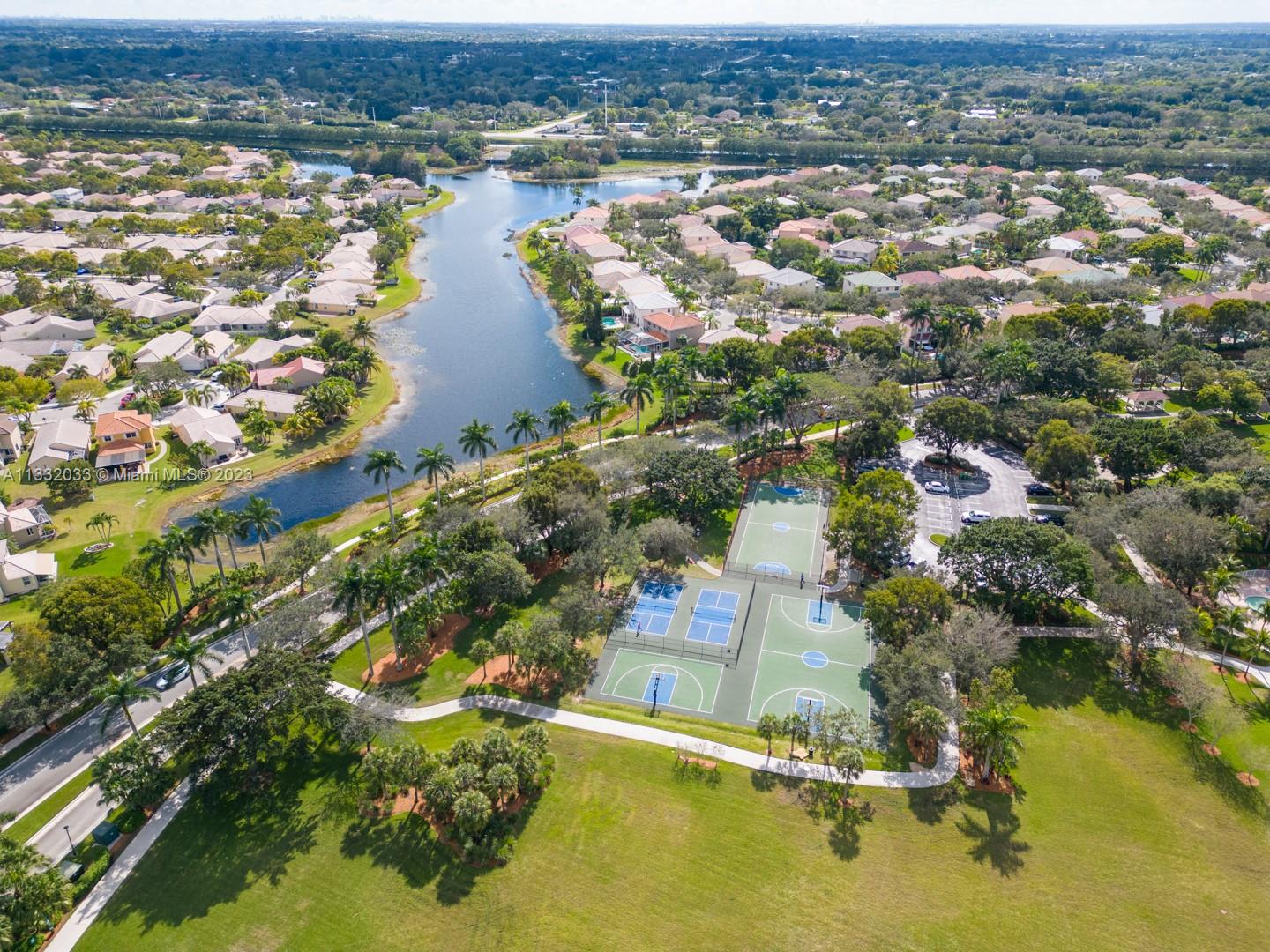 3961 Nighthawk Drive Weston, FL 33331 - Photo 35 of 35 an aerial view of residential houses with outdoor space and lake view