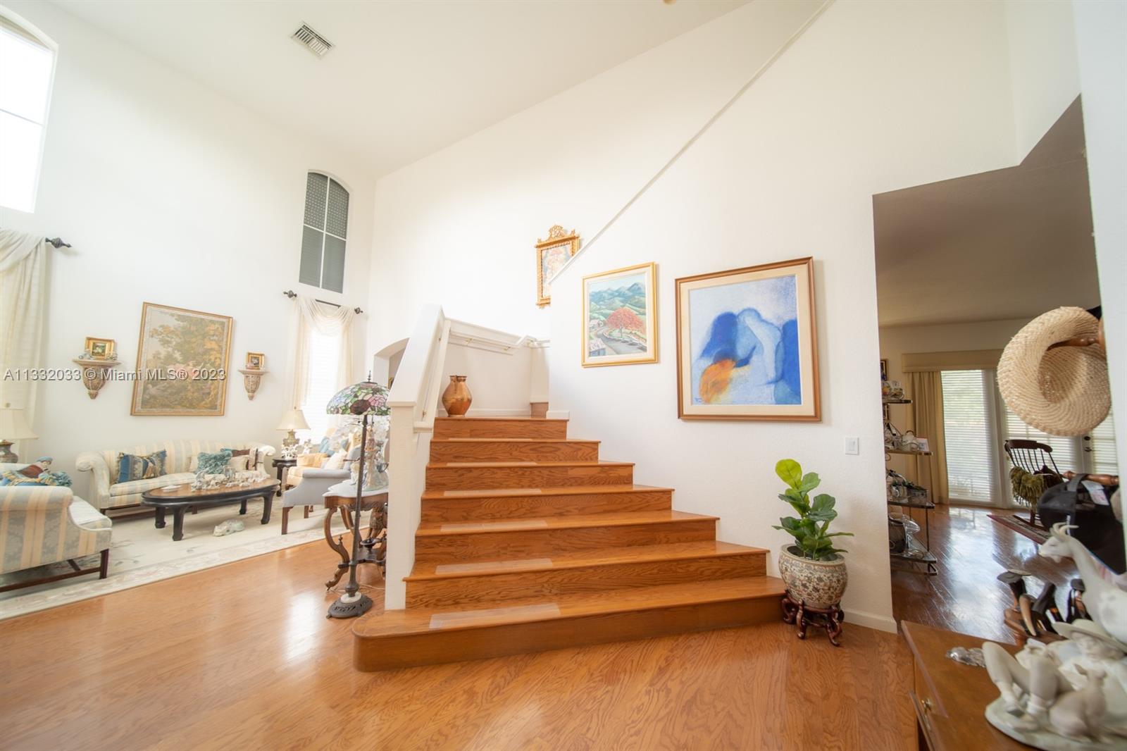 3961 Nighthawk Drive Weston, FL 33331 - Photo 6 of 35 a view of entryway and hall with wooden floor
