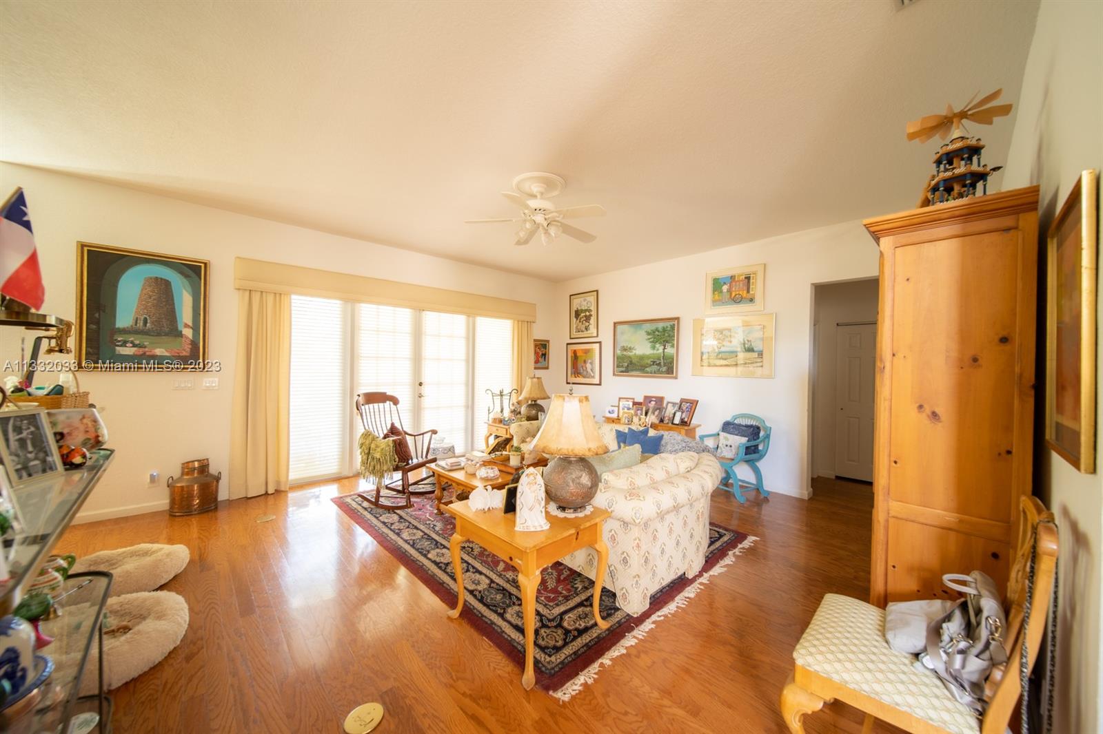3961 Nighthawk Drive Weston, FL 33331 - Photo 7 of 35 a living room with furniture windows and a table