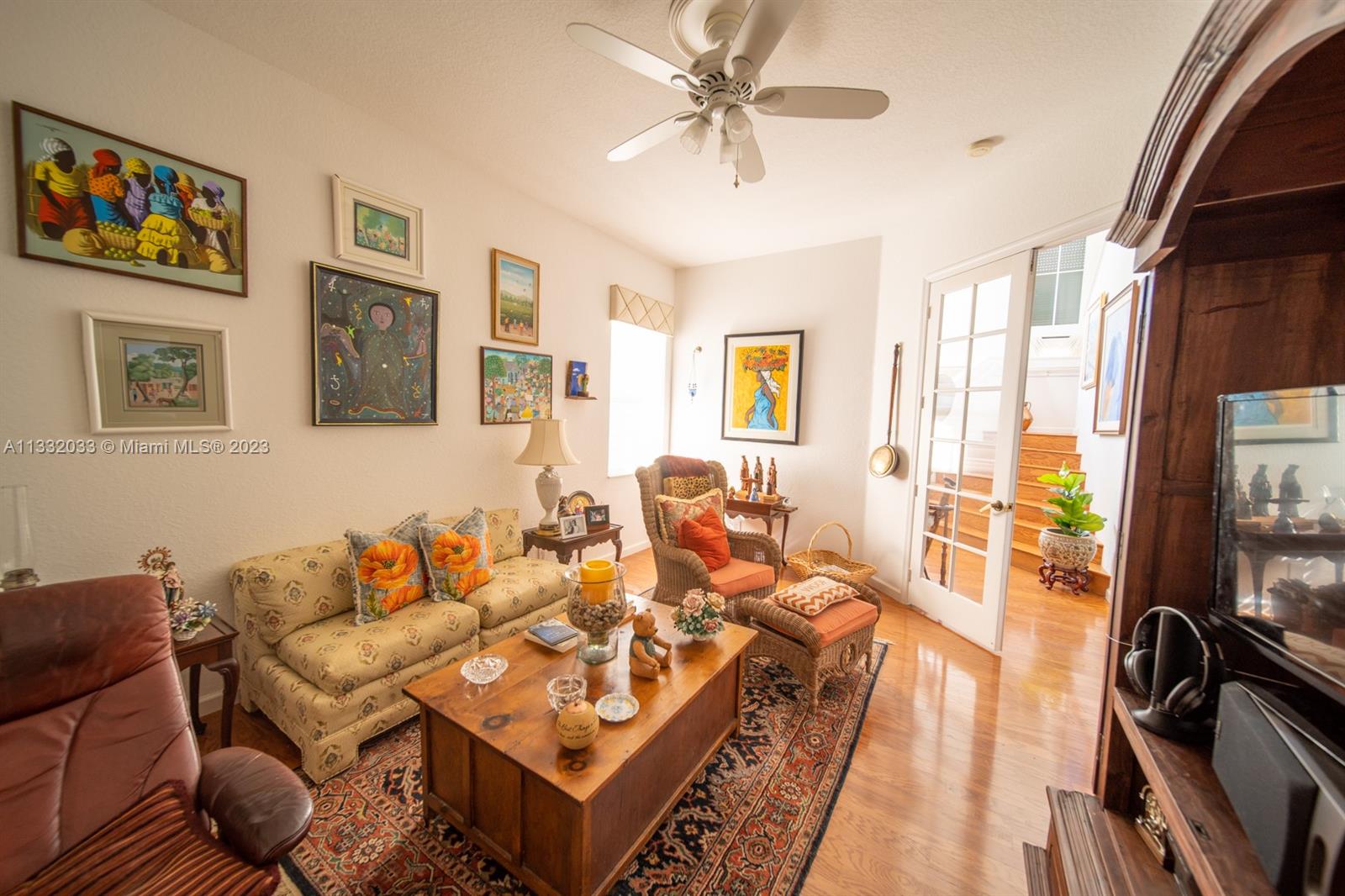 3961 Nighthawk Drive Weston, FL 33331 - Photo 8 of 35 a living room with furniture a flat screen tv and a large window