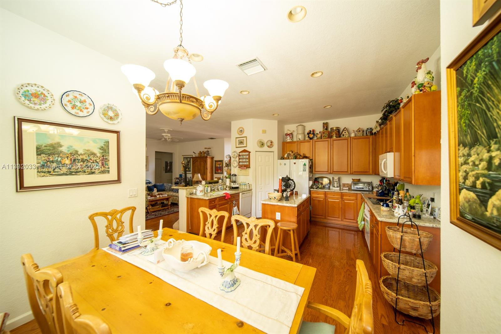 3961 Nighthawk Drive Weston, FL 33331 - Photo 10 of 35 a view of a dining room with furniture a chandelier and a large window