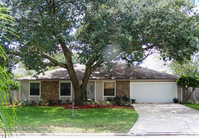 11036 Reading Road Jacksonville, FL 32257 - Photo 1 of 22 a front view of a house with a garden and yard