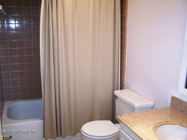 11036 Reading Road Jacksonville, FL 32257 - Photo 22 of 22 a bathroom with a toilet and shower
