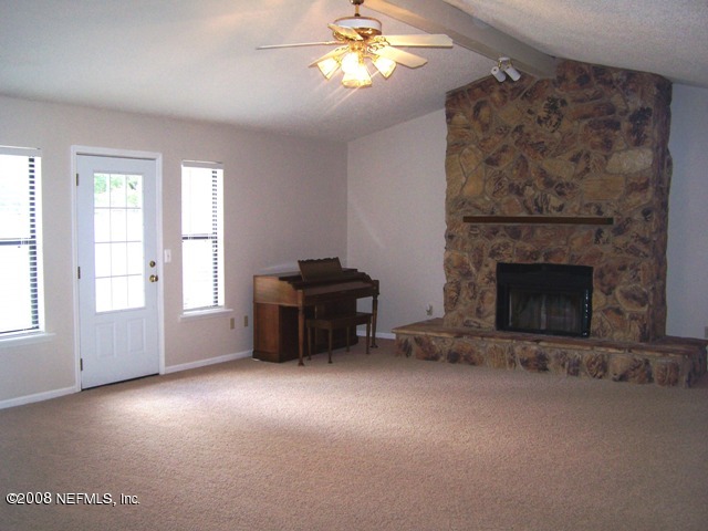 11036 Reading Road Jacksonville, FL 32257 - Photo 4 of 22 a living room with furniture and a fireplace