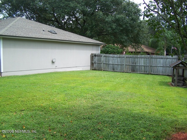 11036 Reading Road Jacksonville, FL 32257 - Photo 6 of 22 a view of a backyard with a small cabin
