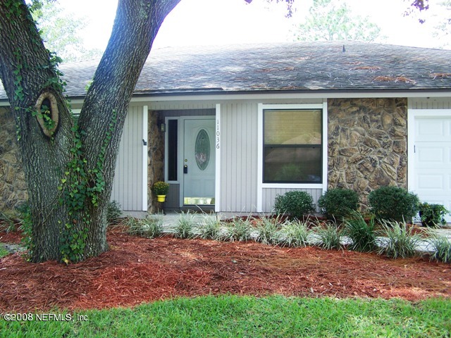 11036 Reading Road Jacksonville, FL 32257 - Photo 7 of 22 a front view of a house with garden