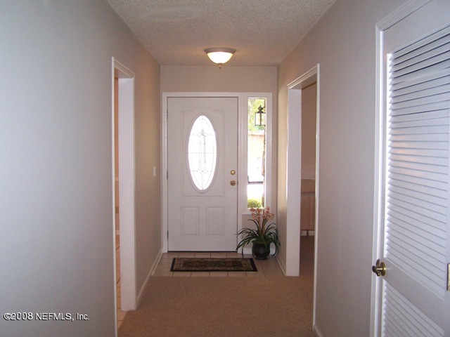 11036 Reading Road Jacksonville, FL 32257 - Photo 8 of 22 a view of a hallway with wooden floor