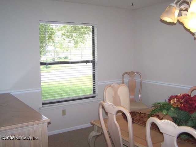 11036 Reading Road Jacksonville, FL 32257 - Photo 10 of 22 a bathroom with a window sink and a mirror