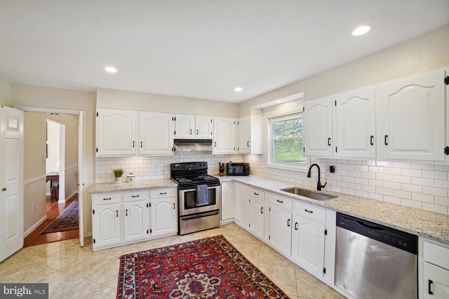 1915 Longmead Road Silver Spring, MD 20906 - Photo 11 of 52 Stainless steel appliances and new tile backsplash