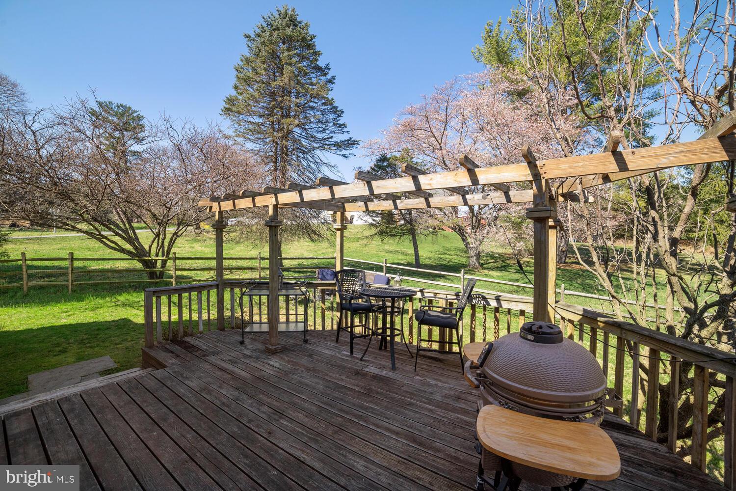 1915 Longmead Road Silver Spring, MD 20906 - Photo 39 of 52 Large deck with pergola overlooking flat backyard