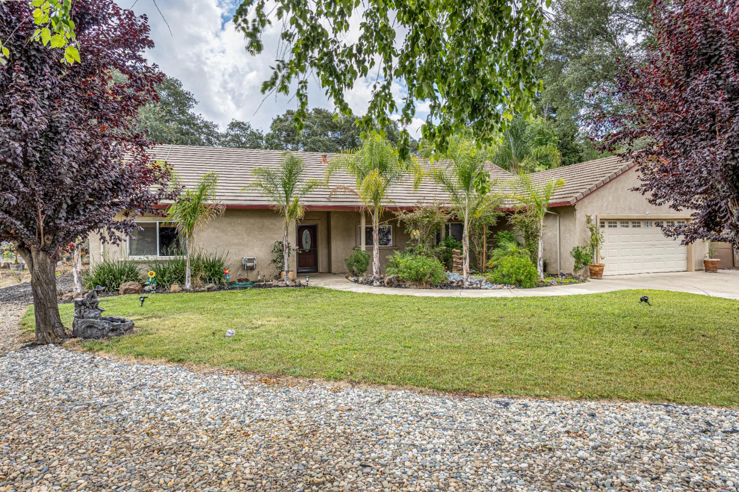 2083 State Rte 26 Valley Springs, CA 95252 - Photo 3 of 59 a front view of a house with a garden