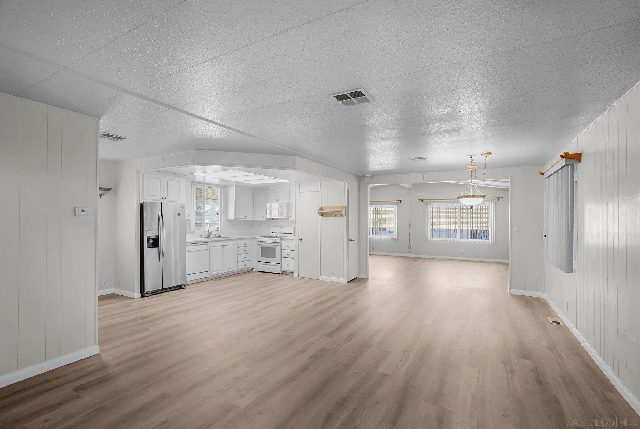 1925 Otay Lakes Road, Unit 167 Chula Vista, CA 91913 - Photo 5 of 11 a view of a livingroom with wooden floor