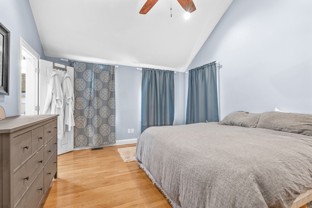 486 Washington Street Walpole, MA 02032 - Photo 11 of 17 a spacious bedroom with a bed and a dresser