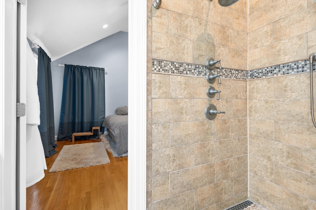 486 Washington Street Walpole, MA 02032 - Photo 12 of 17 a bathroom with a granite countertop shower and a sink