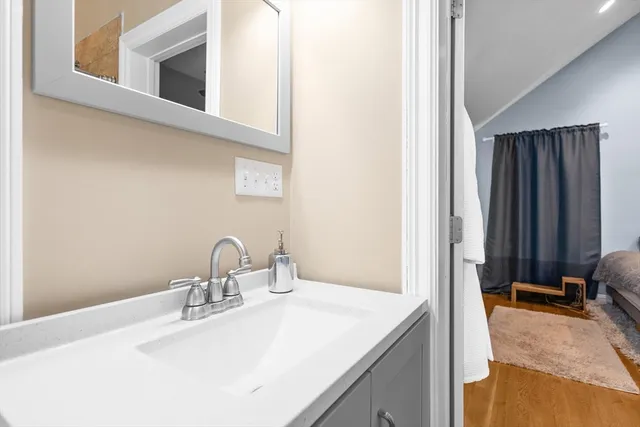 a bathroom with a sink and a mirror