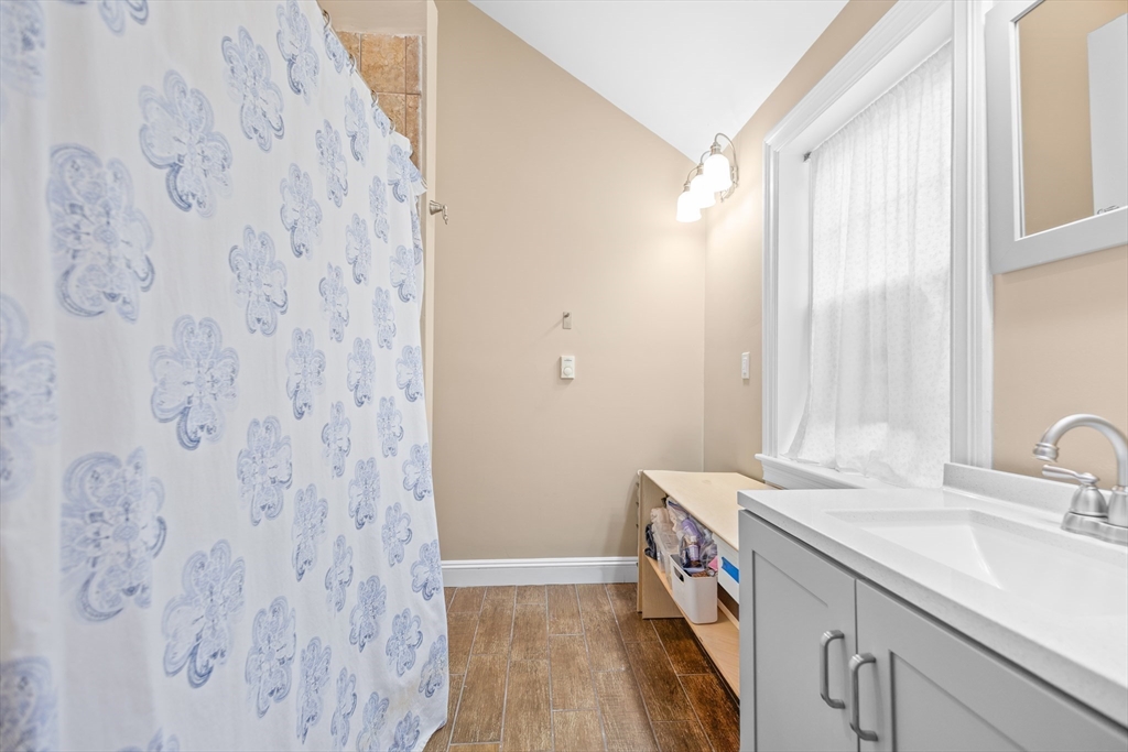 486 Washington Street Walpole, MA 02032 - Photo 14 of 17 a bathroom with a sink and a mirror