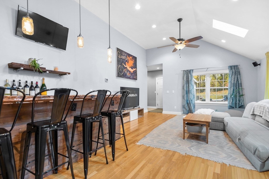 486 Washington Street Walpole, MA 02032 - Photo 3 of 17 a living room with furniture and a flat screen tv