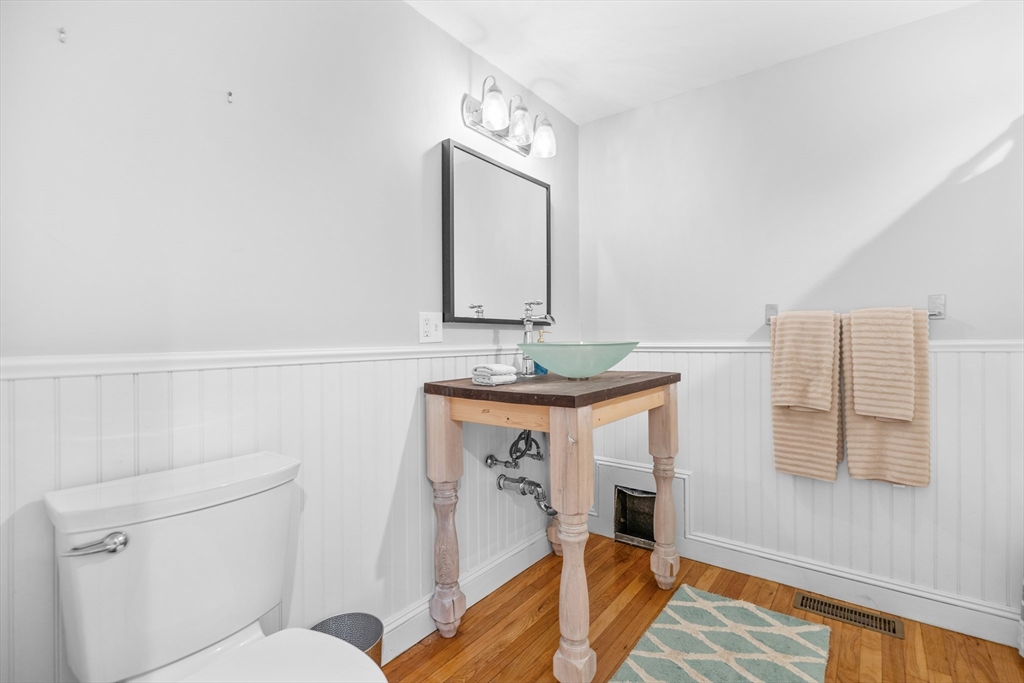 486 Washington Street Walpole, MA 02032 - Photo 9 of 17 a living room with furniture and a mirror