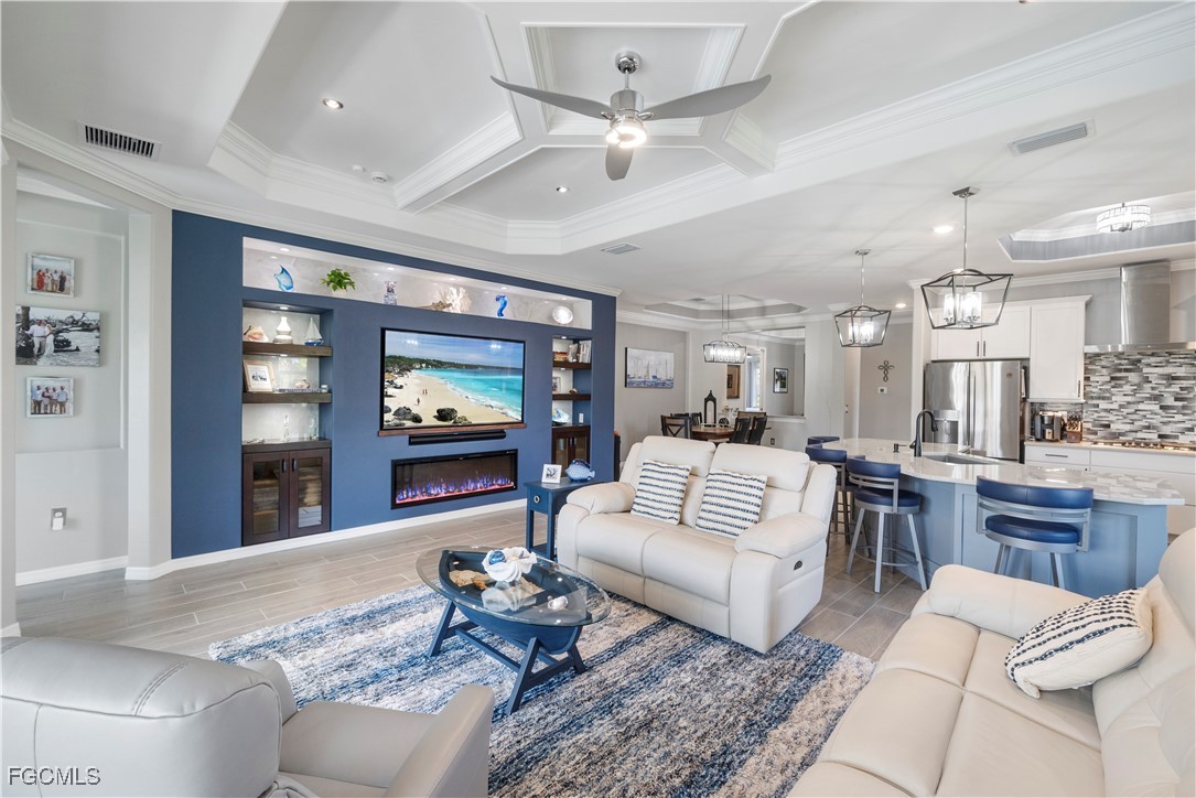 43276 Boardwalk Loop Punta Gorda, FL 33982 - Photo 15 of 50 a living room with furniture ceiling fan and a rug