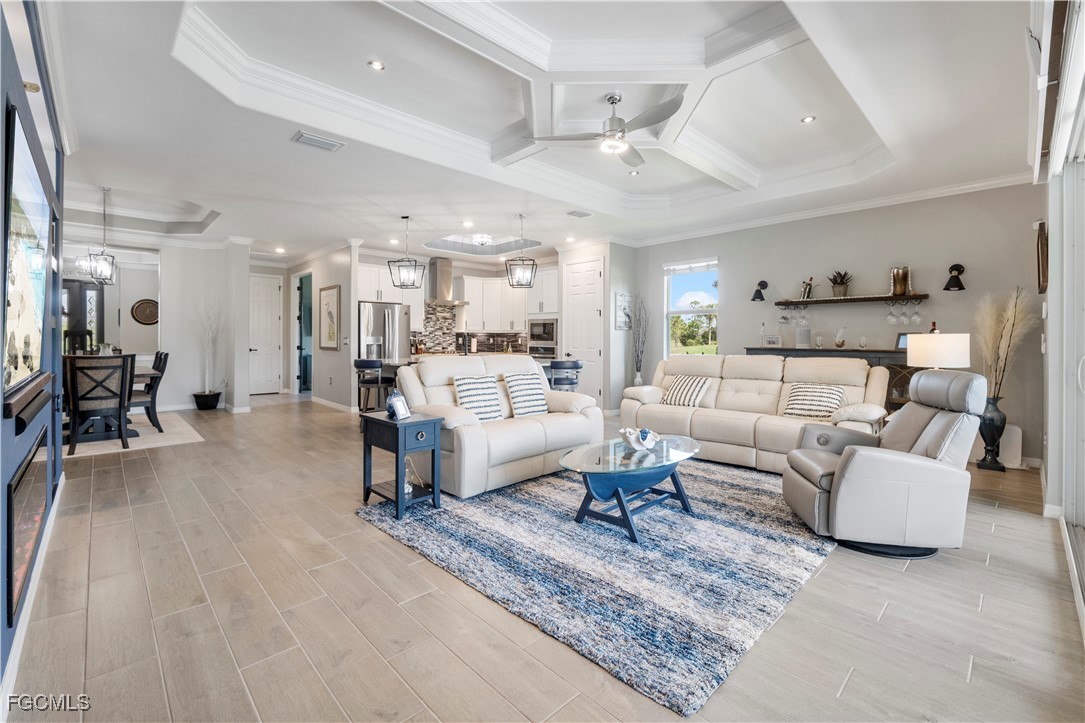 43276 Boardwalk Loop Punta Gorda, FL 33982 - Photo 16 of 50 a living room with furniture and a dining table with kitchen view