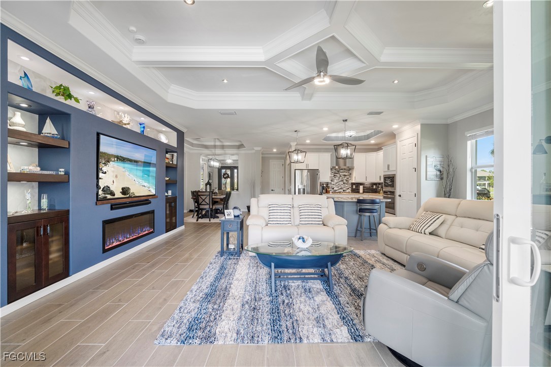 43276 Boardwalk Loop Punta Gorda, FL 33982 - Photo 17 of 50 a living room with furniture and a flat screen tv