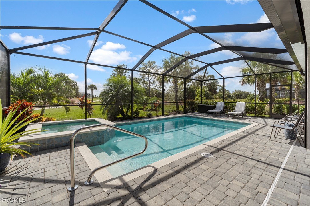 43276 Boardwalk Loop Punta Gorda, FL 33982 - Photo 2 of 50 a view of a swimming pool with a patio