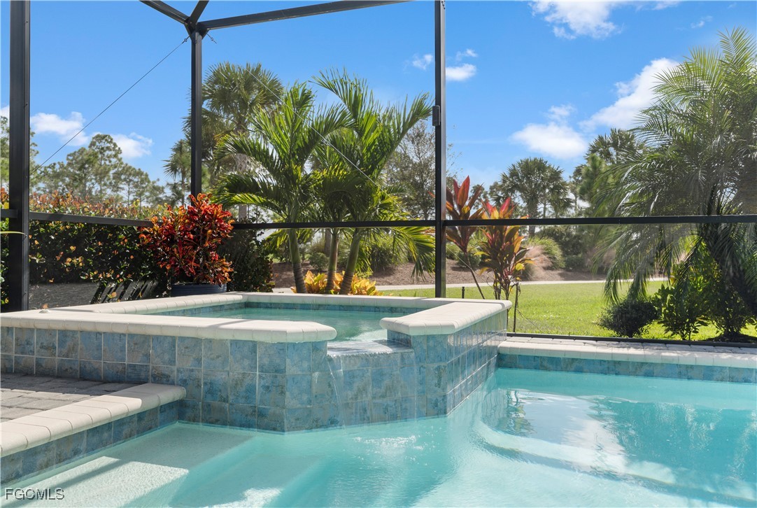 43276 Boardwalk Loop Punta Gorda, FL 33982 - Photo 31 of 50 a view of swimming pool with a patio