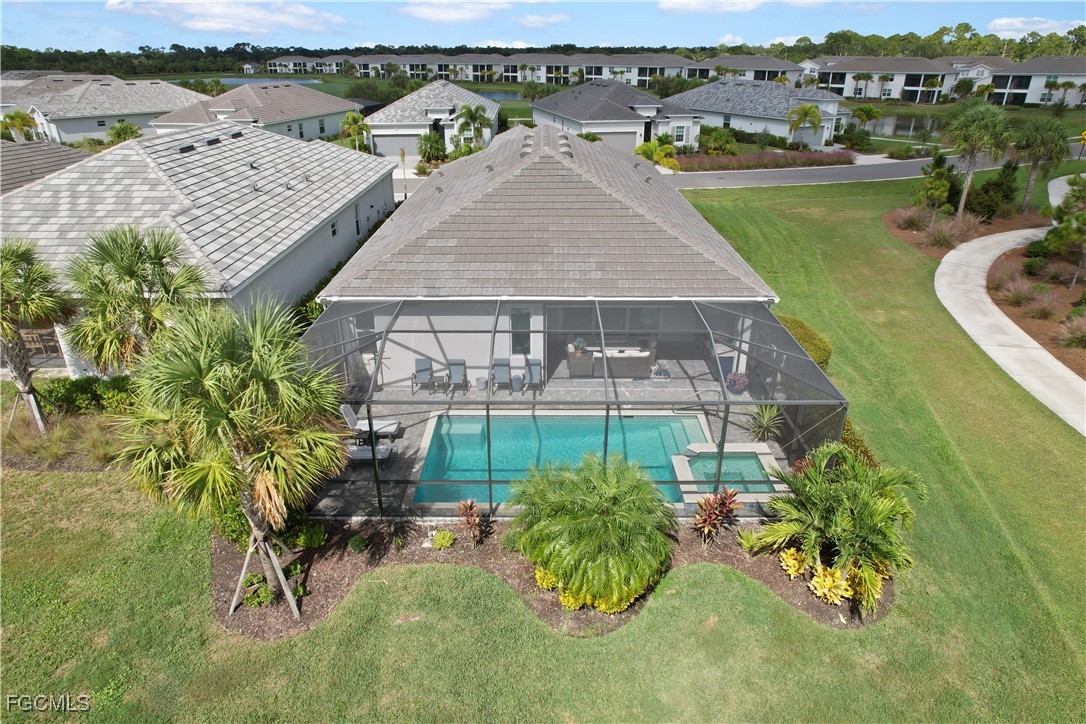 43276 Boardwalk Loop Punta Gorda, FL 33982 - Photo 33 of 50 an aerial view of a house with garden space and lake view