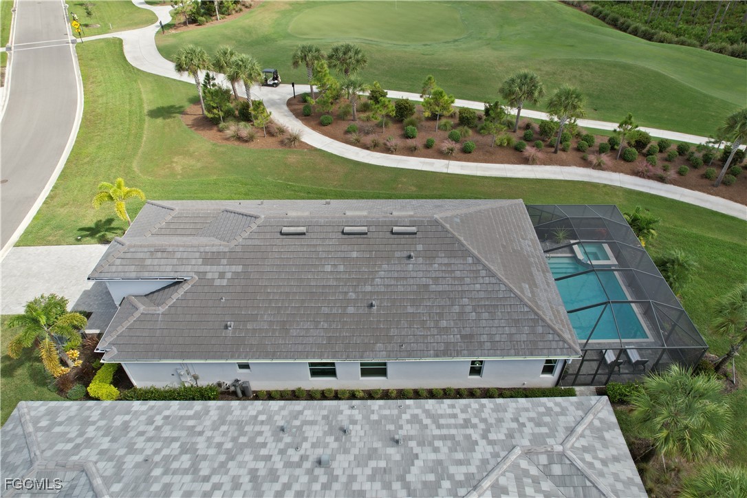 43276 Boardwalk Loop Punta Gorda, FL 33982 - Photo 36 of 50 a view of a swimming pool with a yard